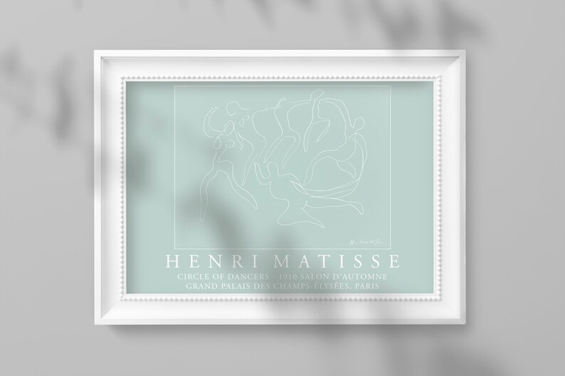 May include: A white line drawing of dancers in a circle on a light blue background. The artwork is framed in white and has the text "HENRI MATISSE" and "CIRCLE OF DANCERS - 1910 SALON D'AUTOMNE GRAND PALAIS DES CHAMPS-ELYSEES, PARIS" below the drawing.