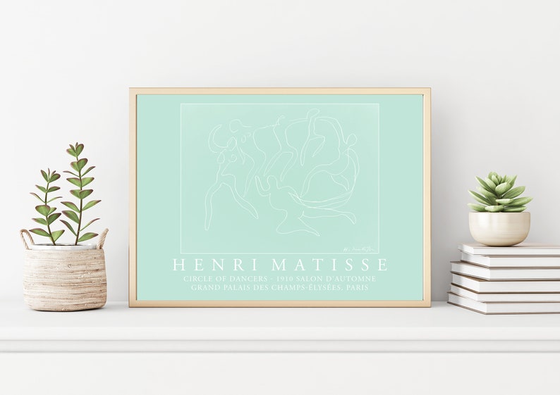 May include: A framed print of a line drawing of dancers in a circle, on a light blue background. The print is titled "Henri Matisse" and includes the text "Circle of Dancers 1910 Salon d'Automne Grand Palais des Champs-Elysees, Paris".