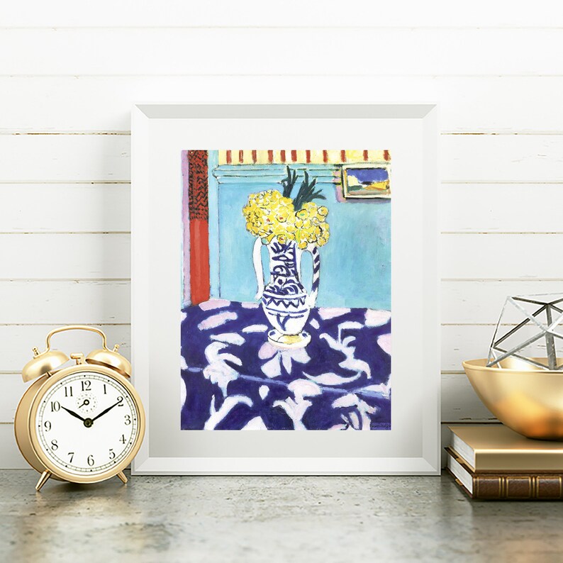 May include: A painting of a blue and white vase filled with yellow flowers on a blue and white patterned tablecloth. The vase is on a table in a room with blue walls and a red door.