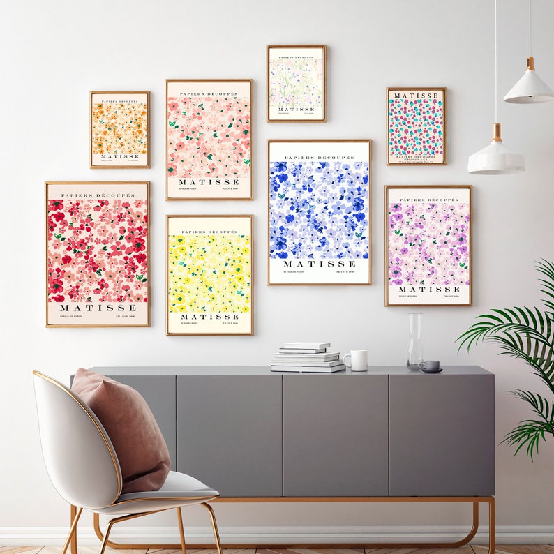 May include: Nine framed prints of floral patterns in various colors, including pink, blue, yellow, and red. Each print features the text "PAPIERS DECOUPES" and "MATISSE" in a black font.
