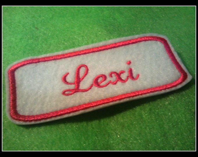 Embroidered  felt  Name Patch withhot pink stitching on white.