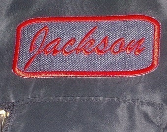 Denim Name Patch rectangle with red embroidery stitching.