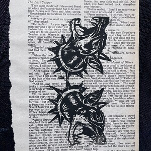 May include: Black and white illustration of Jesus Christ with a crown of thorns on his head. The illustration is from a book page with text about the Last Supper and the betrayal of Jesus by Judas.