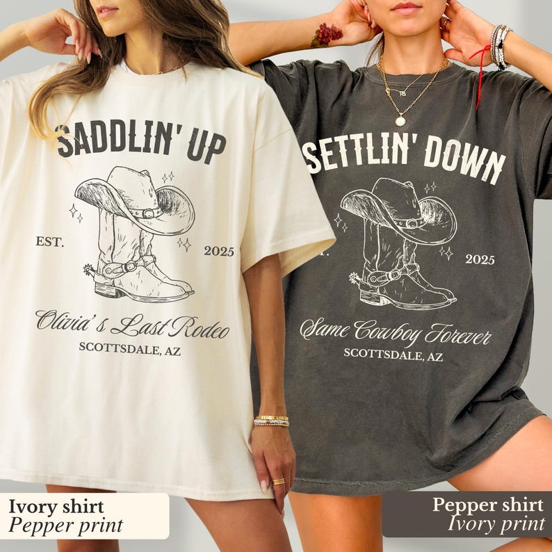 May include: Two oversized t-shirts with a cowboy boot and hat graphic. The ivory shirt has the text "SADDLIN' UP EST. 2025 Olivia's Last Rodeo SCOTTSDALE, AZ". The pepper shirt has the text "SETTLIN' DOWN 2025 Same Cowboy Forever SCOTTSDALE, AZ".