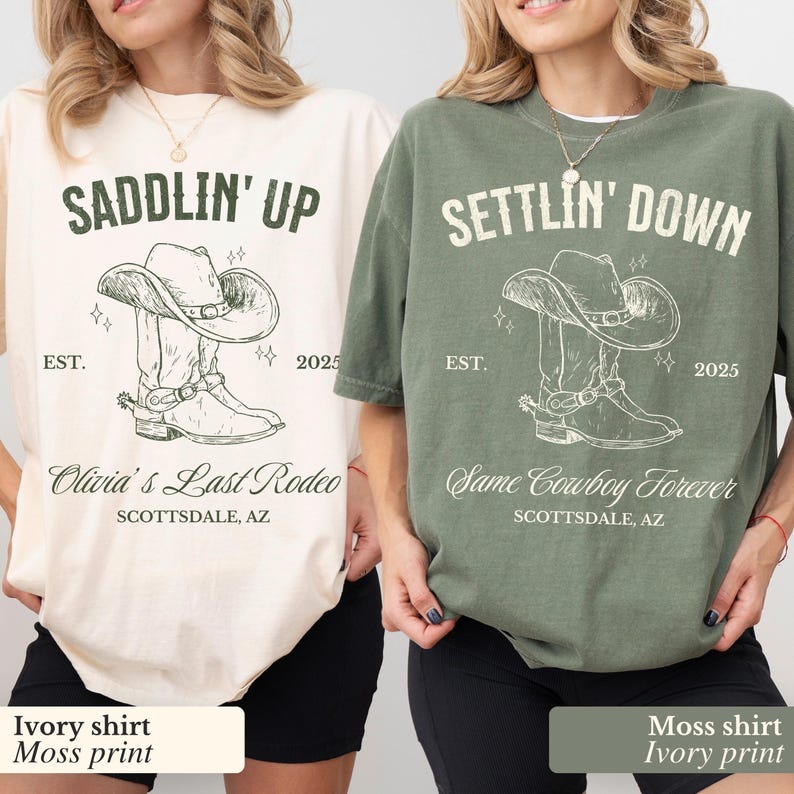 May include: Two t-shirts with a cowboy boot and hat graphic. The ivory shirt has the text "Saddlin' Up" and "Olivia's Last Rodeo" with the location "Scottsdale, AZ". The moss green shirt has the text "Settlin' Down" and "Same Cowboy Forever" with the location "Scottsdale, AZ".