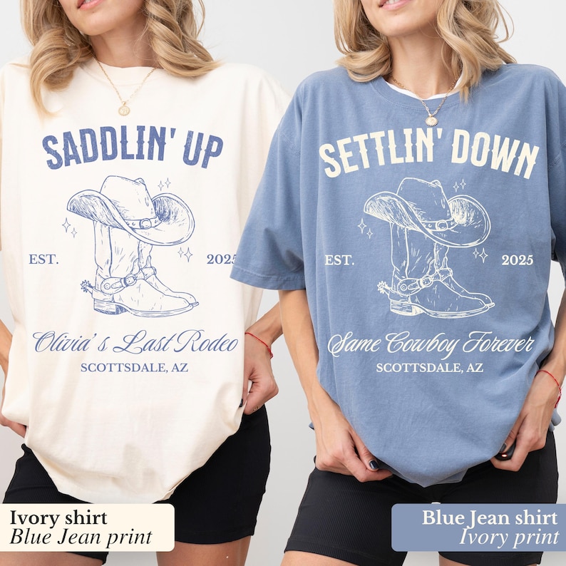 May include: Two t-shirts with a cowboy boot and hat design. The ivory shirt says "Saddlin' Up" and "Olivia's Last Rodeo" with the date "EST. 2025". The blue shirt says "Settlin' Down" and "Same Cowboy Forever" with the date "EST. 2025".