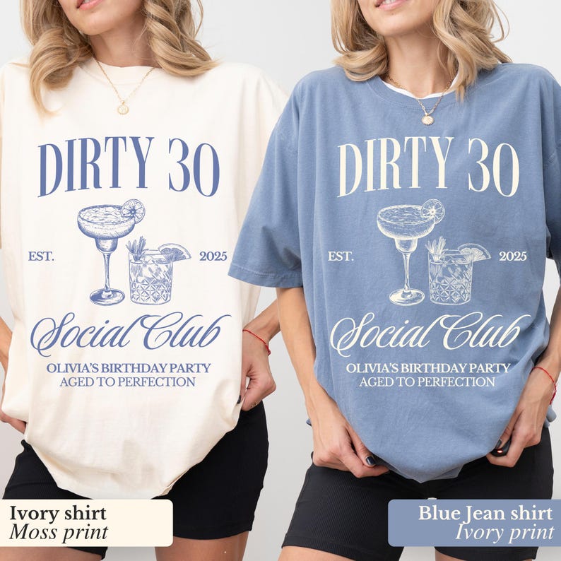 May include: Two t-shirts with the text "Dirty 30 Social Club Olivia's Birthday Party Aged to Perfection" and a graphic of two cocktails. One shirt is ivory with blue text and graphics, the other is blue with ivory text and graphics.