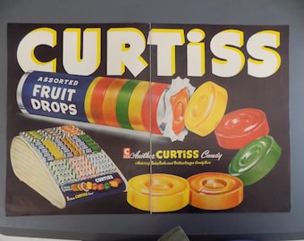 May include: Vintage advertisement for Curtiss Assorted Fruit Drops candy. The ad features a colorful roll of candy and a display of individual candies in a wooden stand. The text on the ad reads "Curtiss Assorted Fruit Drops" and "Another Curtiss Candy".