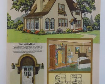 May include: A vintage illustration of a two-story house with a white exterior and a brown roof. The house has a large front porch and a small garden. The illustration is titled "The Cameo" and includes a floor plan and a detail of the entrance with a circle head canopy.