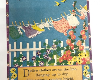 May include: Vintage illustration of clothes hanging on a clothesline against a blue sky. The image features a white picket fence, flowers, and text that reads "Dolly's clothes are on the line, Hanging up to dry, Like a pretty rainbow bright, Against the summer sky."
