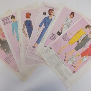 May include: A set of six vintage sewing patterns featuring women's dresses. The patterns are printed on pink and white paper and include instructions and diagrams. The patterns are for sizes 7345 and 7846.