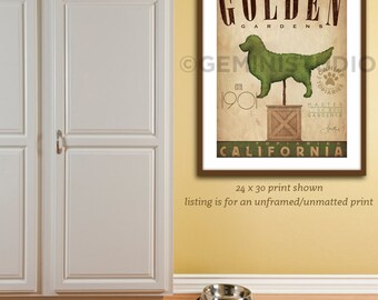 May include: A framed print featuring a topiary dog design with the text "GOLDEN GARDENS CALIFORNIA". The artwork is in a brown frame and is displayed on a yellow wall. A stainless steel dog bowl sits on the wooden floor.