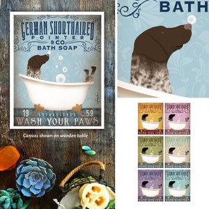 May include: A vintage-style illustration of a German Shorthaired Pointer dog taking a bath in a white bathtub with bubbles. The text reads "German Shorthaired Pointer & Co. Bath Soap" and "Established 1959 Wash Your Paws".