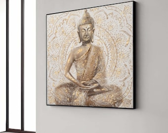 Puede incluir: Una obra de arte en lienzo enmarcada que presenta una figura de Buda sentado en posición de meditación. El Buda está representado en tonos dorados y bronce, sobre un fondo blanco con un diseño de mandala dorado.