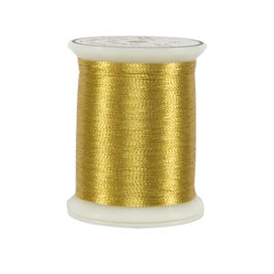 May include: A spool of metallic gold embroidery thread wound around a white plastic cylinder. The thread has a reflective, shiny finish and is wrapped evenly from top to bottom, showing a consistent texture and bright yellow-gold color.