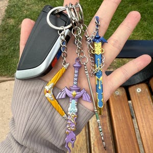 Op de legende van Zelda geïnspireerde sleutelhanger|Sleutelhanger|Lightscale drietand, Sea-Breeze boemerang, gerestaureerd, rottend meesterzwaard