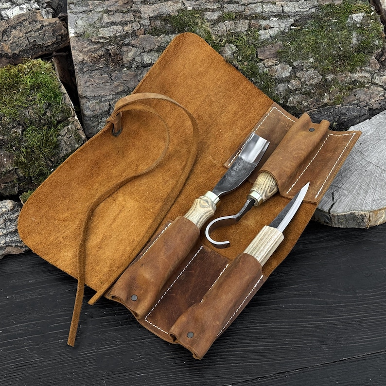 Spoon carving tool set arranged in leather roll, forged wood carving knives with ash handles.