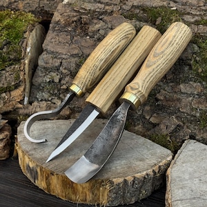 Hand-forged bowl carving tools on wood slice, hook knife and gouge for hollowing work.