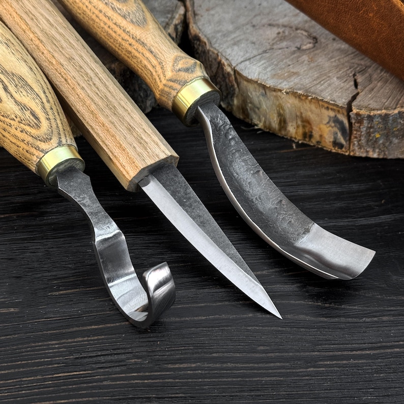 Detailed view of hook knife, carving knife and gouge blades for spoon and bowl carving.