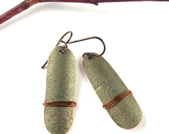 Hand cut, hammered green patina copper earrings.