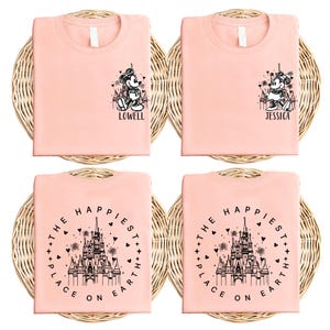a set of four pink t - shirts with a castle on it