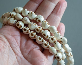 10mm Skull Beads in Faux Howlite, Off White Color, Fun Lightweight Halloween Skeleton Bead Lot, With Darkened Eye Sockets, Teeth and Veining