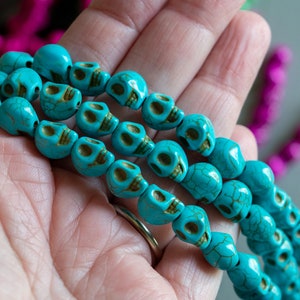 10mm Skull Beads in Faux Howlite, Turquoise Color, Fun Lightweight Halloween Skeleton Bead Lot, With Darkened Eye Sockets, Teeth, Veining