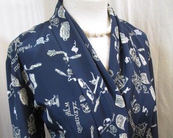 Vintage Calligraphy print Blouse 80s Alphabet script Ink pen and well Novelty print Shawl collar Peplum wrap Blue and cream shirt  M