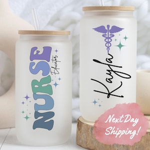 May include: Two frosted glass tumblers with bamboo lids and straws. One tumbler has the word "NURSE" in colorful letters with stars and the text "Educator". The other tumbler has a purple caduceus symbol with stars and the name "Kayla" in black cursive.
