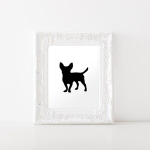 May include: Black silhouette of a chihuahua dog in a white frame.