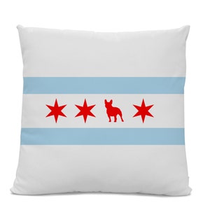 May include: White pillow with a blue and white striped design and three red stars and a red silhouette of a French bulldog. The design is reminiscent of the Chicago flag.