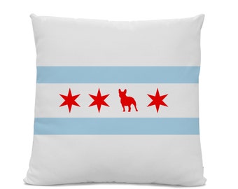 May include: White pillow with a blue and white striped design and three red stars and a red silhouette of a French bulldog. The design is reminiscent of the Chicago flag.