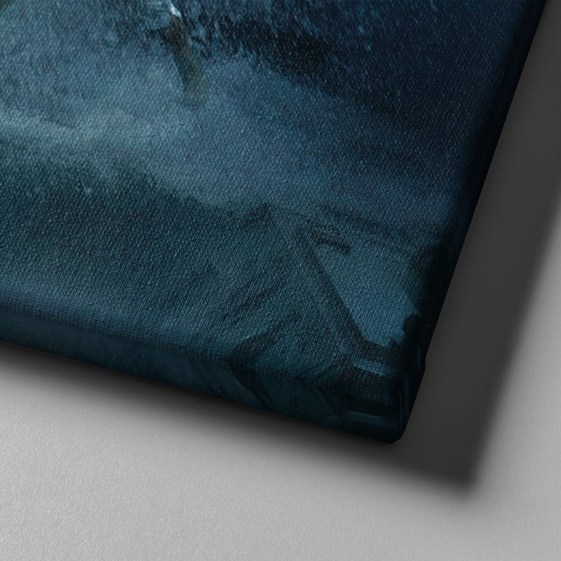 May include: A canvas print with a dark blue and teal abstract design. The artwork has a textured appearance, with visible brushstrokes and color variations. The canvas is stretched over a wooden frame, and the corner of the canvas is visible.