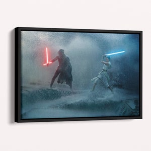 May include: A framed canvas print featuring a scene from a science fiction film. Two figures are engaged in a lightsaber duel, one with a red lightsaber and the other with a blue lightsaber. The background is a stormy, water-filled environment.