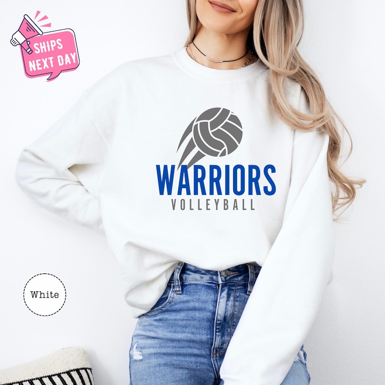 a woman wearing a sweatshirt that says warriors volleyball