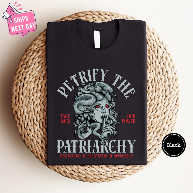 a black t - shirt with a picture of a woman's face on it