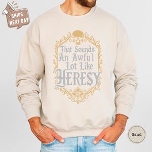 a man wearing a sweatshirt with a quote on it