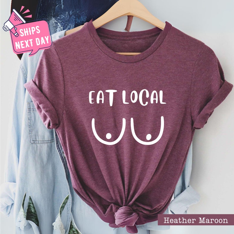 a t - shirt with the words eat local on it
