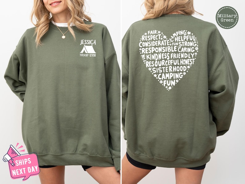 a woman wearing a green sweatshirt with white writing on it