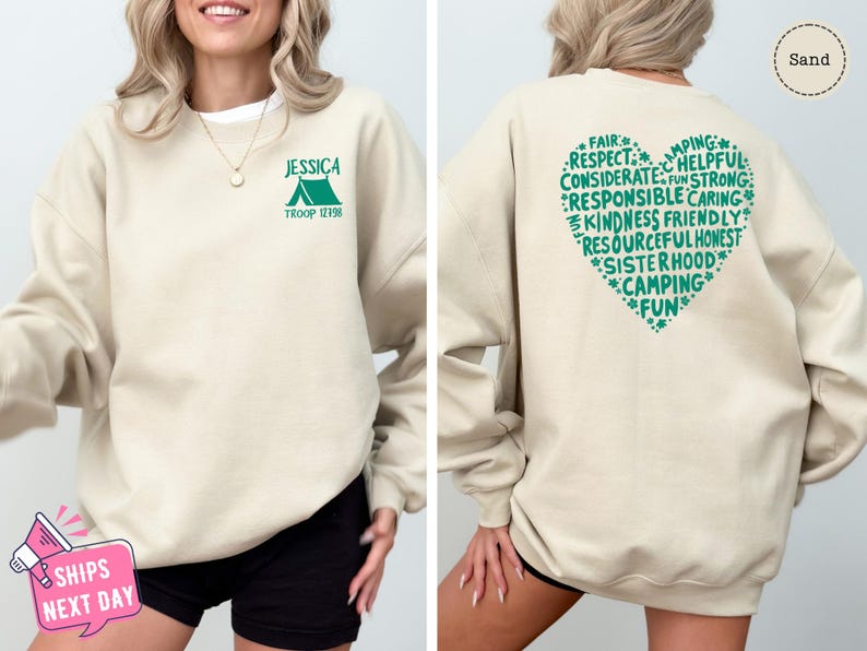 a woman wearing a sweatshirt with the words camping printed on it