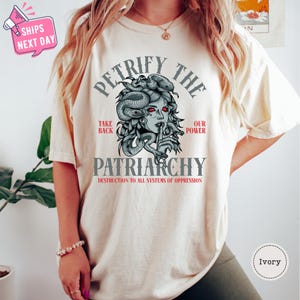 a woman wearing a t - shirt with an octopus on it