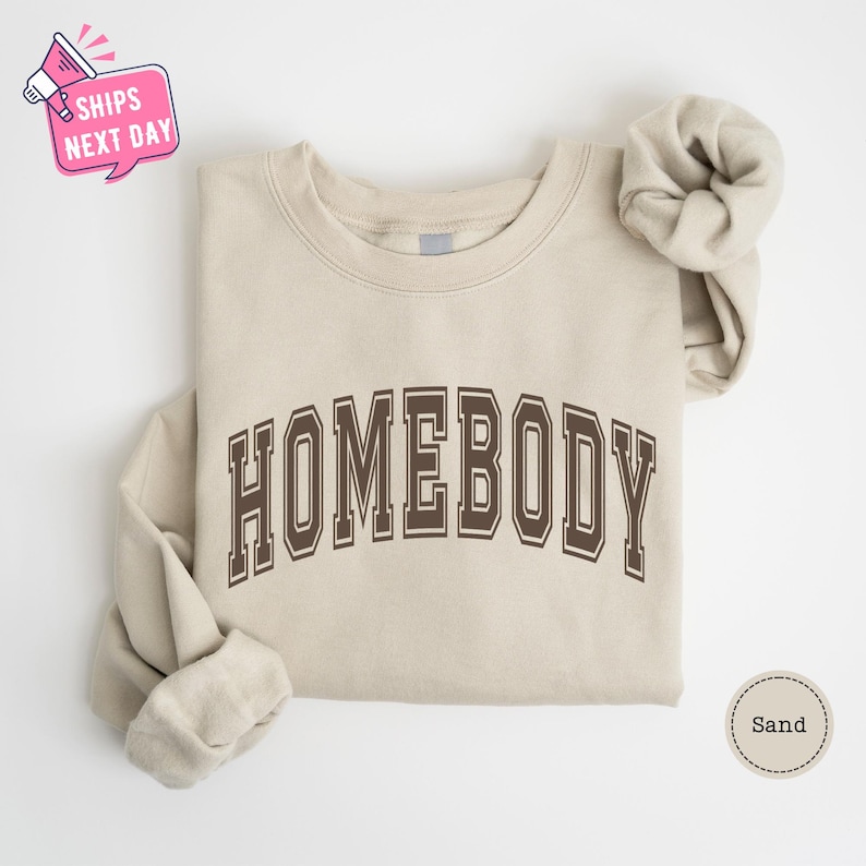 a sweater with a bow on the front and a t - shirt with the word