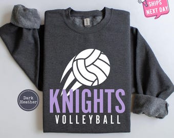 May include: Dark heather grey sweatshirt with a white volleyball graphic and the text "KNIGHTS VOLLEYBALL" in purple.