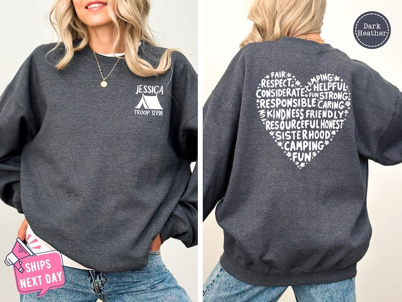 a woman wearing a sweatshirt with a heart on it