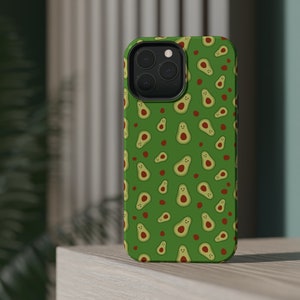 May include: A green phone case with a pattern of smiling avocado illustrations and red dots.