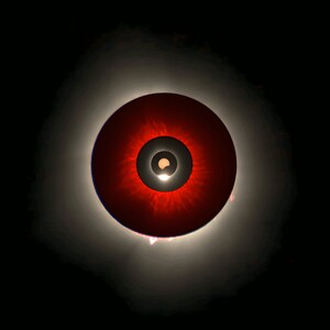 May include: A red circle with a black ring and a smaller white circle in the center. The red circle has a radial pattern of light and dark red.