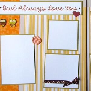 May include: A scrapbook page with a striped background and orange accents. The page has several blank photo frames and a title that reads "Owl Always Love You".