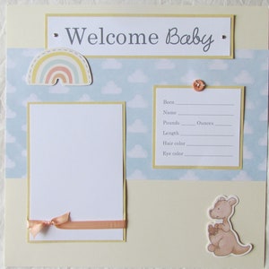 Scrapbook albums paired with Hello Baby Paper Packs – perfection