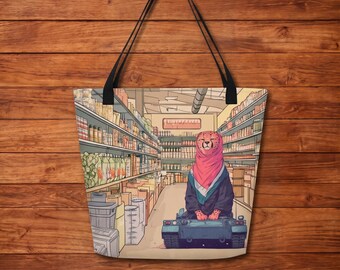 May include: A tote bag featuring a graphic illustration of a cheetah wearing a pink hijab and dark clothing, sitting on a small blue tank in the middle of a grocery store aisle lined with shelves stocked with various food products and containers.
