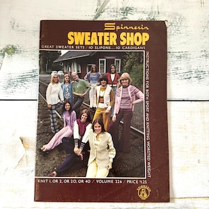 May include: A vintage brown book cover for "Spinnerin Sweater Shop" showing a group of people in sweaters and cardigans. The cover includes text such as "Great Sweater Sets" and "Instructions for Both Sport and Knitting Worsted Weight."